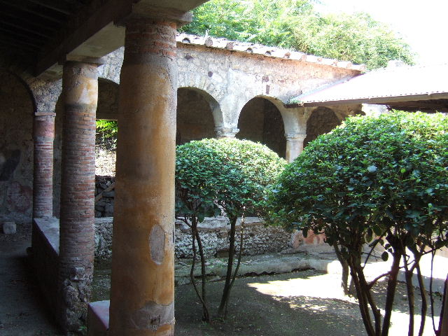 I.17.4 Pompeii.  May 2006. Open area or yard on south side of peristyle garden.  Reconstructed wooden upper gallery.
