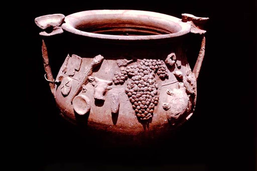 II.1.12 Pompeii, 1978. Terracotta vase found with other cult objects. Photo by Stanley A. Jashemski.   
Source: The Wilhelmina and Stanley A. Jashemski archive in the University of Maryland Library, Special Collections (See collection page) and made available under the Creative Commons Attribution-Non Commercial License v.4. See Licence and use details. J78f0591
