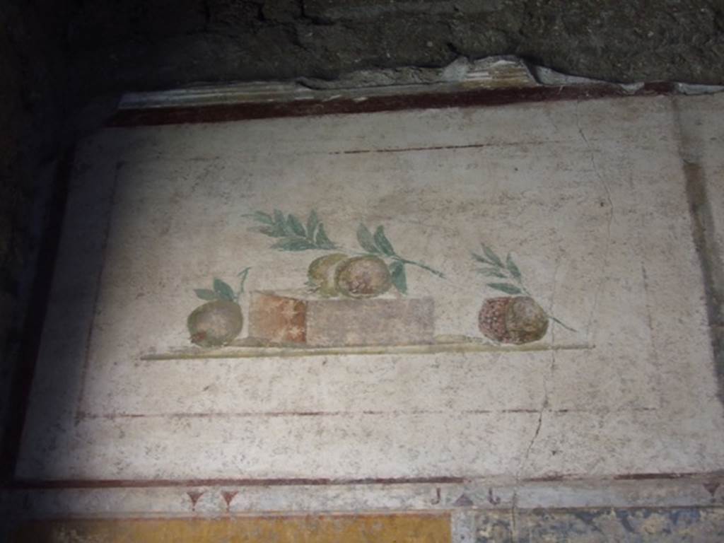 II.1.12 Pompeii. March 2009. Upper wall of south wall of triclinium with wall painting of pomegranates.
