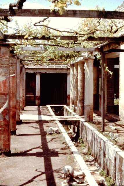 II.2.2 Pompeii.  December 2005.  Room 13.  Garden.  Looking north from near the third pool at the south end of garden.


