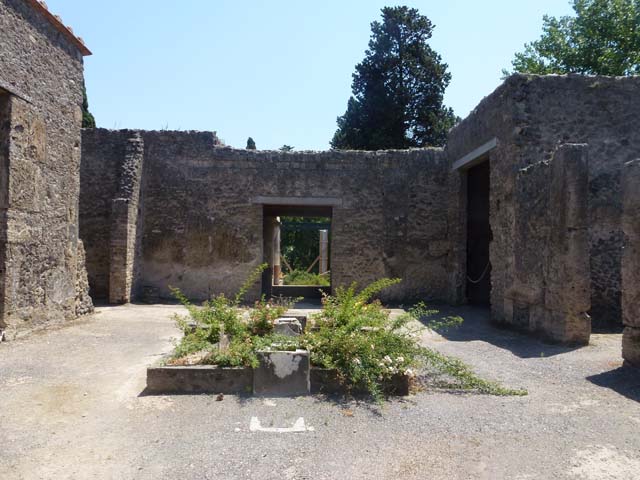 II.2.2 Pompeii. March 2009. Doorway to room 3, cubiculum on west side of atrium. As a result of the bombing of 19th September 1943, nearly all of the IV Style decoration of the central cubiculum was lost. The decoration from the north and west wall, and part of the south wall, were destroyed. In this cubiculum badly damaged were two figured paintings. One of a female, possibly of the wife or daughter of Loreius, according to Della Corte. The other was the The rape of Europa, only partially damaged and restored. See Garcia y Garcia, L., 2006. Danni di guerra a Pompei. Rome: L’Erma di Bretschneider. (p.45-47)