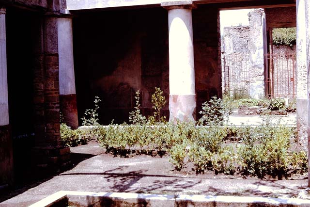 II.2.2 Pompeii.  March 2009. Room 13.  Garden.  Wall of Nymphaeum on west side. Remains of painting of Diana or Artemis.