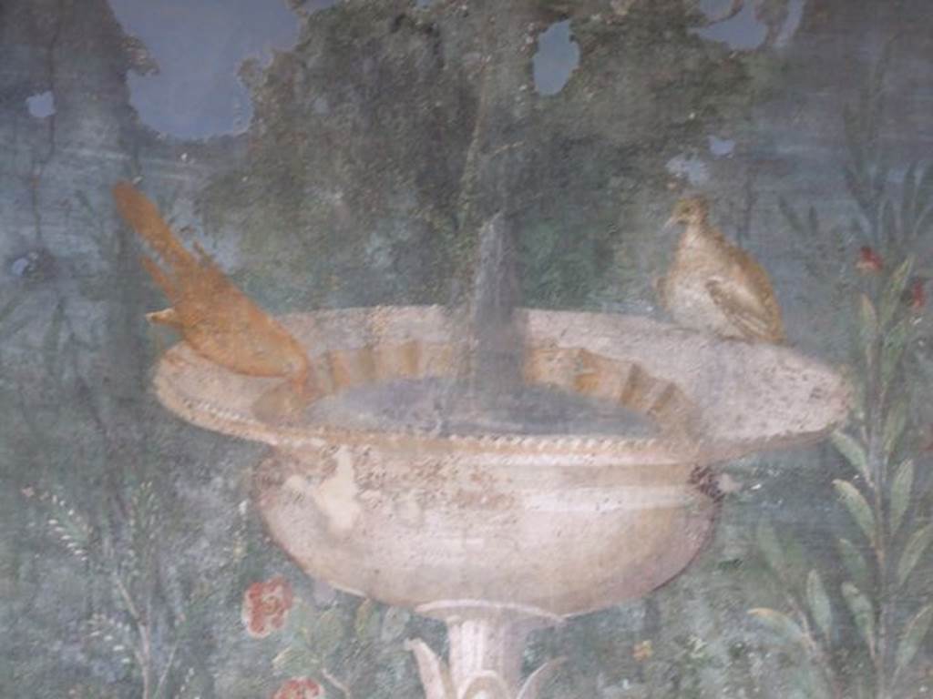 II.3.3 Pompeii. December 2006. Room 11, west panel of south wall of peristyle. Detail of wall painting of fountain with garden and birds.

