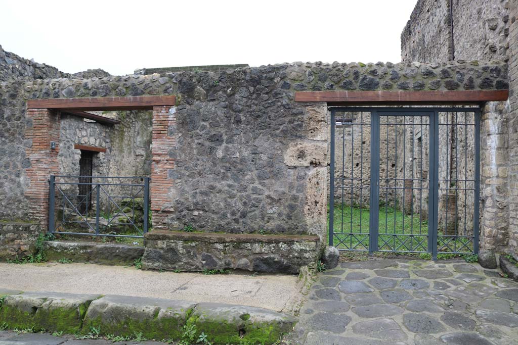 II.4.4 Pompeii, on right. December 2018. Looking south to entrance doorway, with II.4.5 on left. Photo courtesy of Aude Durand.