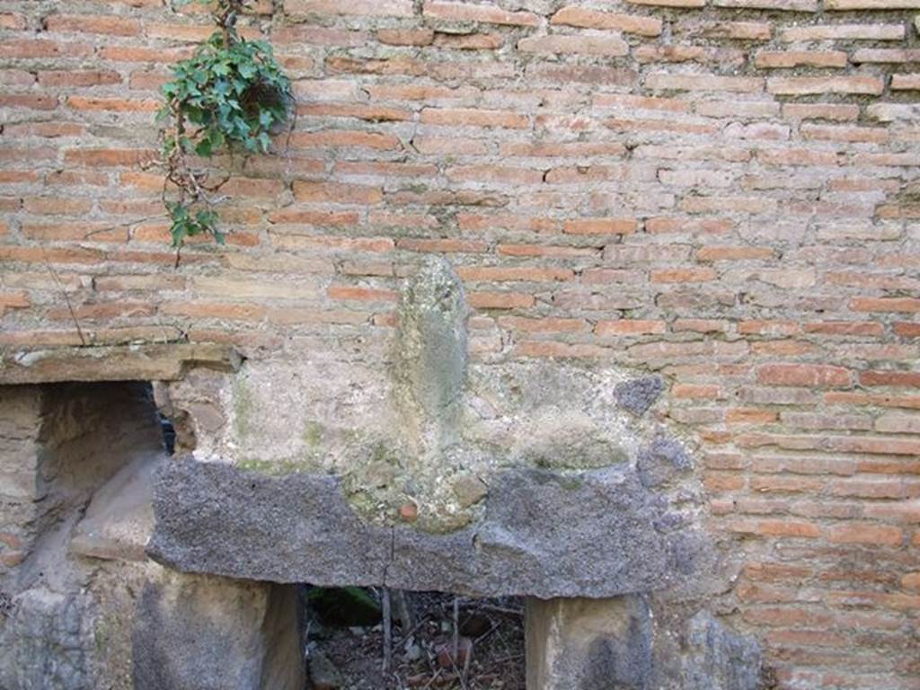 II.4.4 Pompeii. December 2006. Phallus on wall of praefurnium or furnace.