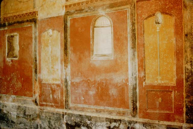 II.4.6 Pompeii. December 2006.  Room to north of summer Triclinium, and wall decoration in portico