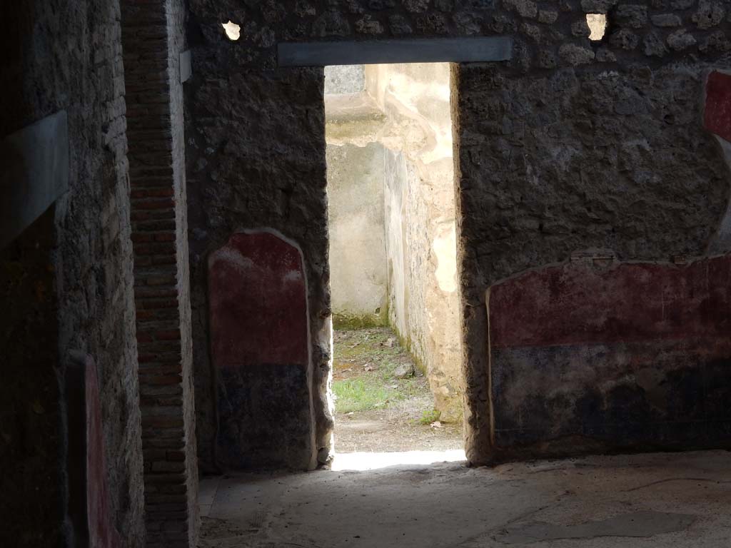 II.4.10 Pompeii. June 2019. Looking south across atrium towards doorway to room on south side.
Photo courtesy of Buzz Ferebee.
