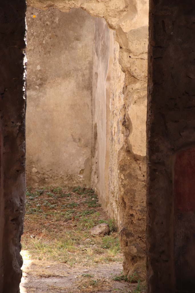 II.4.10 Pompeii. September 2019. Looking south through doorway into room on south side of atrium.
Photo courtesy of Klaus Heese.
