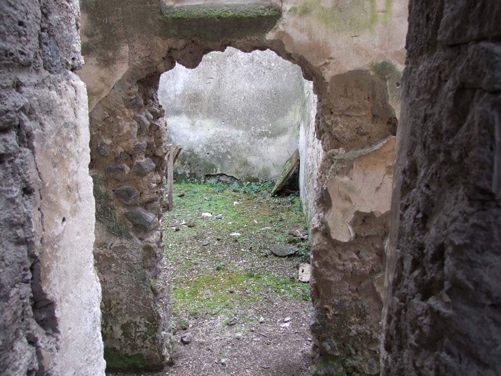 II.4.10 Pompeii. December 2006. Doorway into room to south of atrium. Looking south.