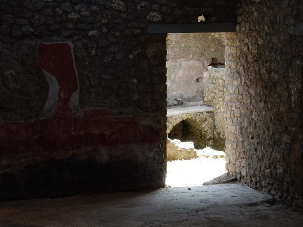 II.4.10 Pompeii. June 2019. Looking south across atrium towards doorway to kitchen on south side.
Photo courtesy of Buzz Ferebee.
