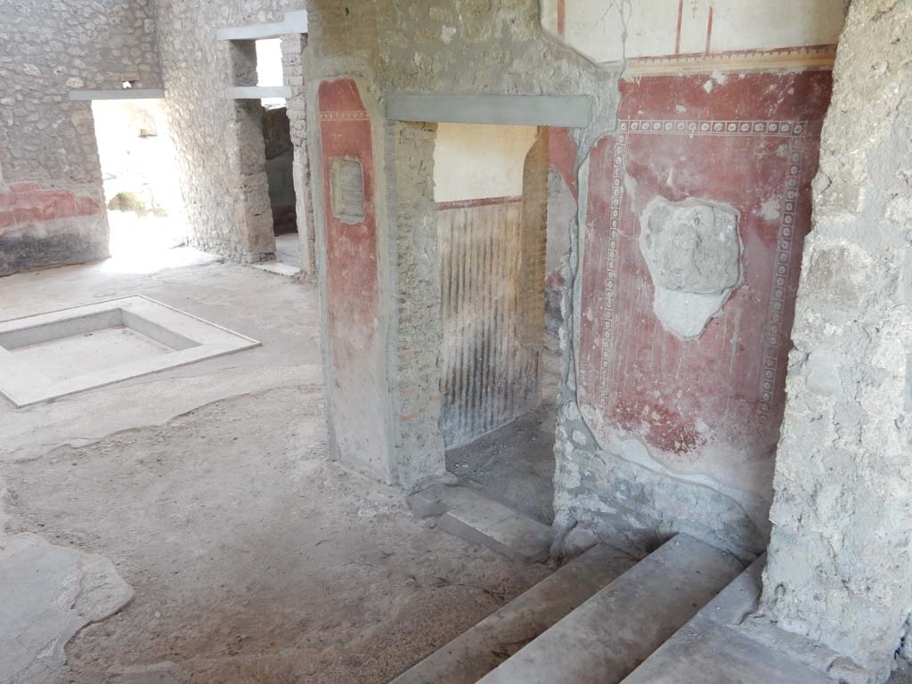 II.4.10 Pompeii. June 2019. Looking south-west across atrium towards doorway to kitchen, left, and doorway on its right, to a room on the west side of the atrium. Photo courtesy of Buzz Ferebee.

