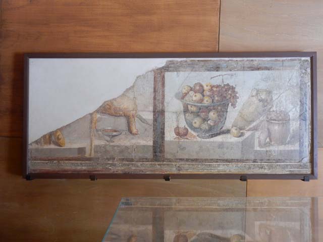 II.4.10 Pompeii. May 2016. Wall painting of two still-life panels including a dead game bird and a glass bowl filled with fruit. Found 6th July 1755. Now in Naples Archaeological Museum.  Inventory number 8611. Photo courtesy of Buzz Ferebee.
