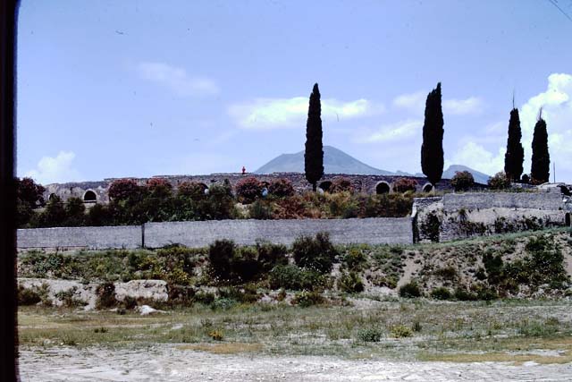 II.6 Pompeii. 1972. Looking north to ampitheatre and section of wall.  Photo by Stanley A. Jashemski. 
Source: The Wilhelmina and Stanley A. Jashemski archive in the University of Maryland Library, Special Collections (See collection page) and made available under the Creative Commons Attribution-Non Commercial License v.4. See Licence and use details. J72f0429
