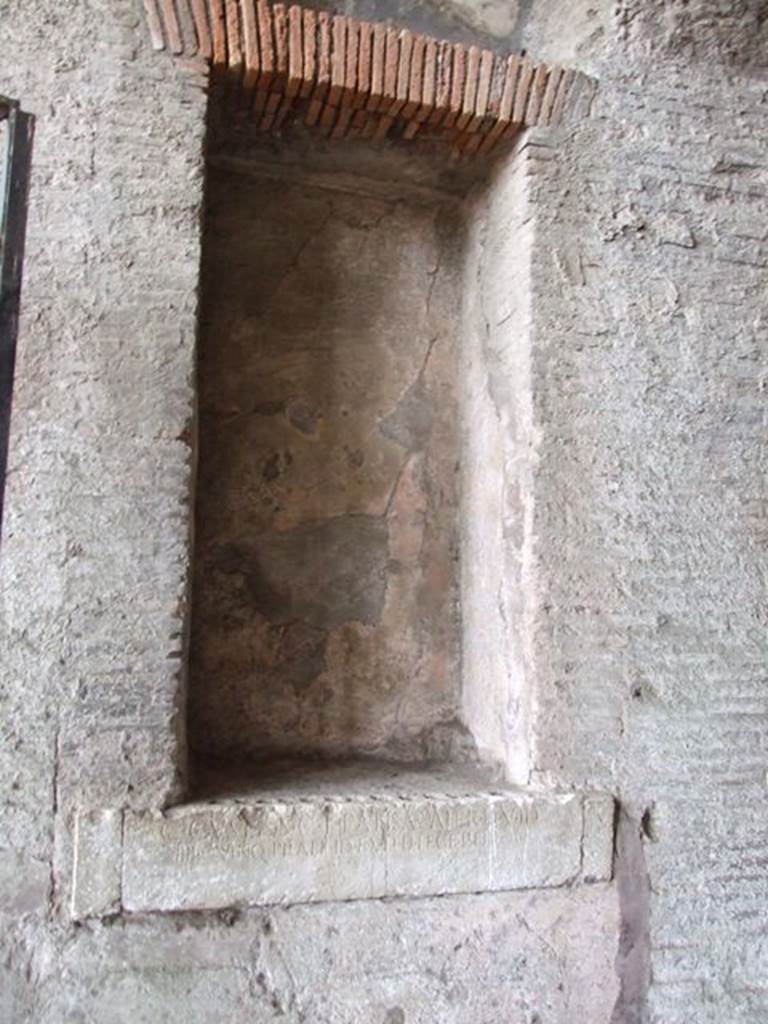 6 Pompeii. December 2006. Inscription from east side of corridor of Amphitheatre. The inscription reads –
C. CVSPIVS C. F. PANSA PATER D. V. I  D
IIII. QVINQ. PRAEF. ID. EX. D. D. LEGE. PETRON.
One of two inscriptions to father and son, Cuspius Pansa.  
They restored the Amphitheatre at their own expense after the earthquake of AD62.
According to Pagano and Prisciandaro, this read –
C(aius) Cuspius C(ai) f(ilius) Pansa pater d(uum) v(ir) i(ure) d(icundo)
IIII quinq(uennalis) praef(ectus) i(ure) d(icundo) ex d(ecreto) d(ecurionum) lege Petron(i)    [CIL X 858]  See Pagano, M.  and Prisciandaro, R., 2006. Studio sulle provenienze degli oggetti rinvenuti negli scavi borbonici del regno di Napoli.  Naples : Nicola Longobardi. 
(p.110)

