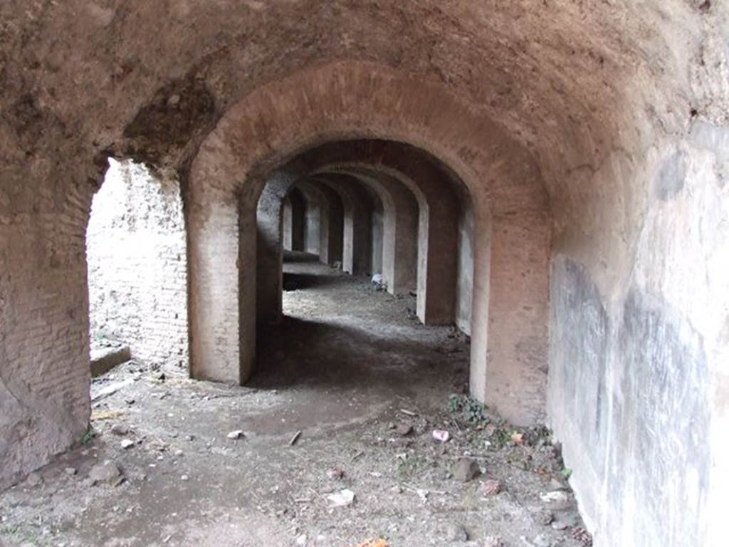 II.6 Pompeii. December 2006. Doorway under Amphitheatre, on west side of entrance corridor from north.According to Mau, there are three of these small dark rooms, near the end of the three corridors. Their purpose was unknown, but they may have been storerooms. See Mau, A., 1907, translated by Kelsey, F. W., Pompeii: Its Life and Art. New York: Macmillan. (p. 215-6).
