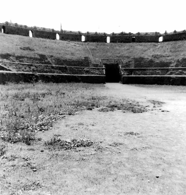 II.6 Pompeii.  Amphitheatre.  March 2009.  Looking north east from upper level.  The small boxes visible along the upper level, possibly for women, who were only allowed to have a place in the upper portion of the Amphitheatre. See Mau, A., 1907, translated by Kelsey F. W. Pompeii: Its Life and Art. New York: Macmillan. (p.218).