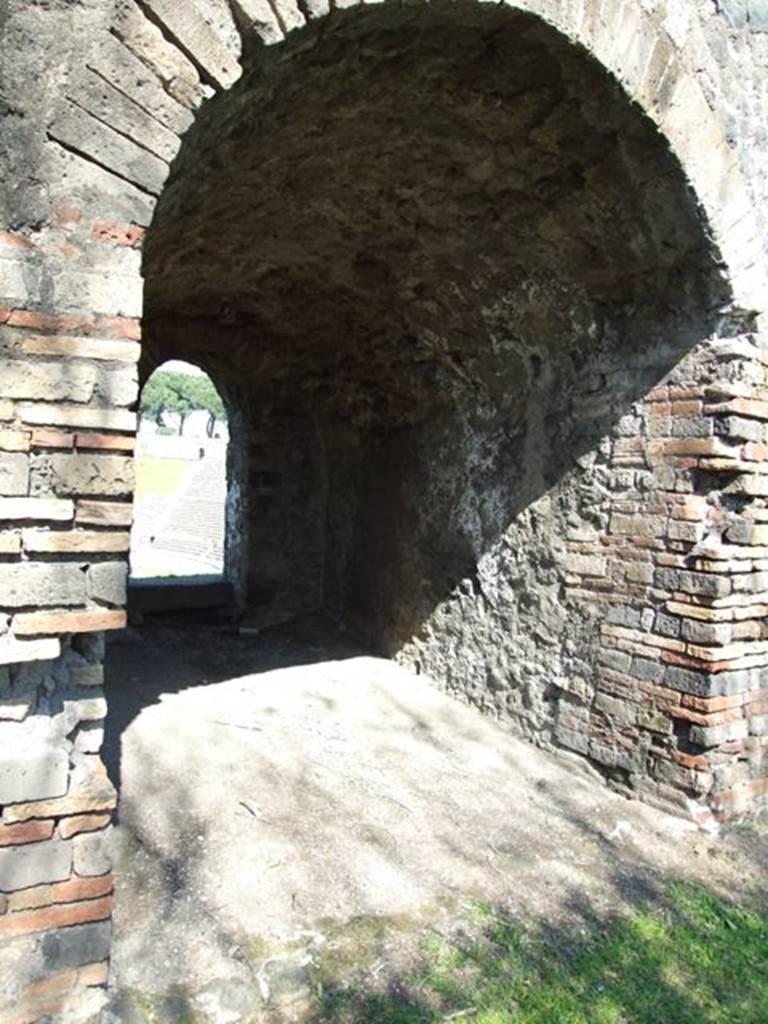 II.6 Pompeii. March 2009.  Arched passageway leading through to upper seating of the Amphitheatre.  