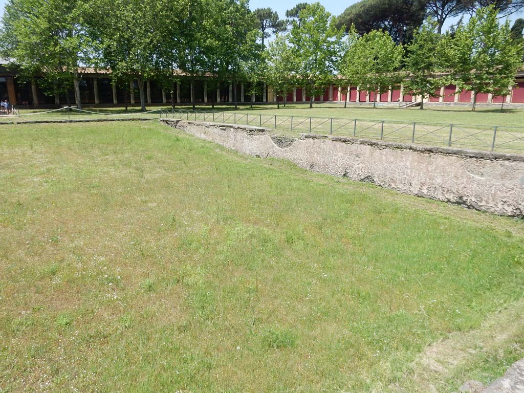 II.7 Pompeii. June 2019. Looking across pool to north-west corner of Palestra. Photo courtesy of Buzz Ferebee.
