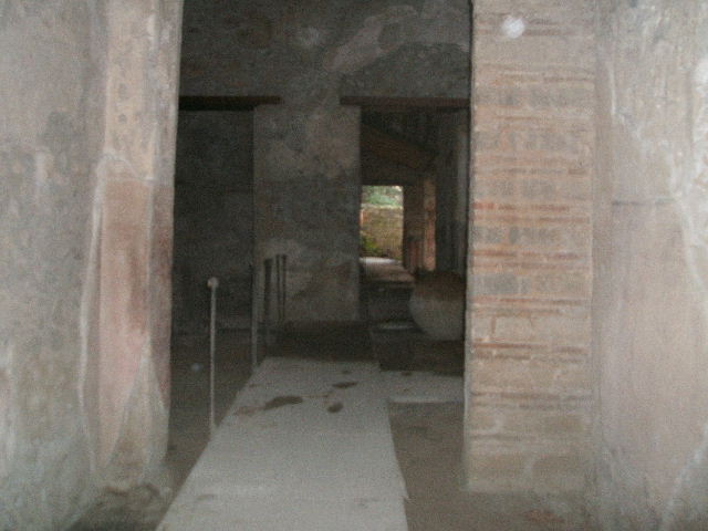 II.9.1 Pompeii. December 2007. West wall of atrium, and south west corner, with two windows and blocked doorway.   