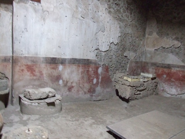 II.9.1 Pompeii. December 2007. Two painted figures in centre of west wall in room with large window on south side behind atrium.  According to Giacobello, a painted lararium was seen on the west wall of room 9, in the centre of white wall plaster. A serpent was coiled around an altar, the Genius assisted by a camillo was sacrificing. The Lares were at the sides of this scene. See Giacobello, F., 2008. Larari Pompeiani: Iconografia e culto dei Lari in ambito domestico.  Milano: LED Edizioni. (p.162)
Frohlich refers to as a very faded painting on the west wall of room 9?
See Fröhlich, T., 1991, Lararien und Fassadenbilder in den Vesuvstädten.  Mainz: von Zabern. (L41b: p.266). 
