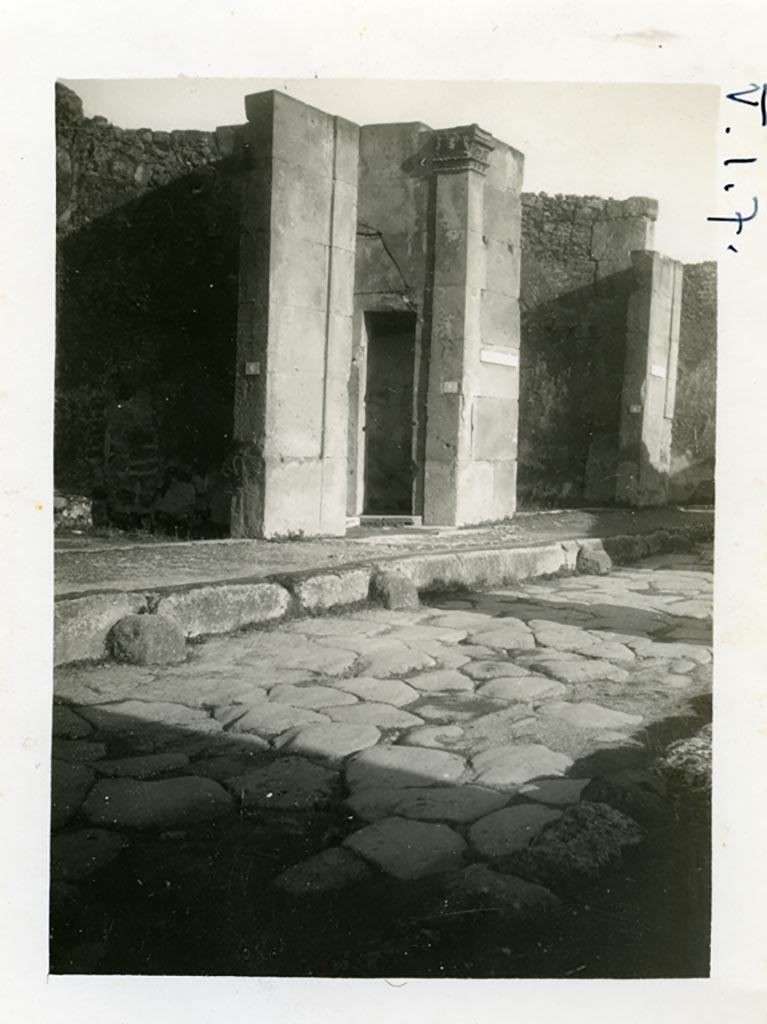 V.1.7 Pompeii. Pre-1937-39. Looking north-east on Via di Nola towards entrance doorway.
On the right side of the main entrance doorway, the doorway to a small room can be seen.
Photo courtesy of American Academy in Rome, Photographic Archive. Warsher collection no. 1482.
