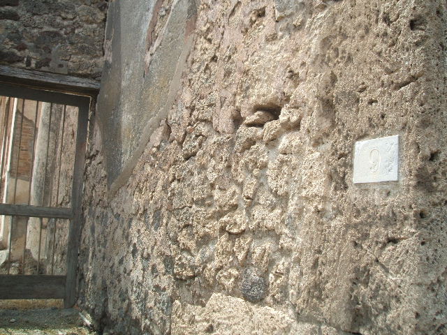 V.1.7 Pompeii. March 2009.   Room on south side of Rear entrance fauces, with two doorways.  Looking north.