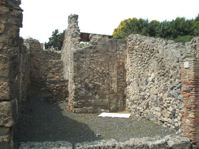 V.2.9 Pompeii. May 2010. Looking north in rear room. The north wall has a small window to V.2.10, and the site of stairs to upper floor against the east wall.
