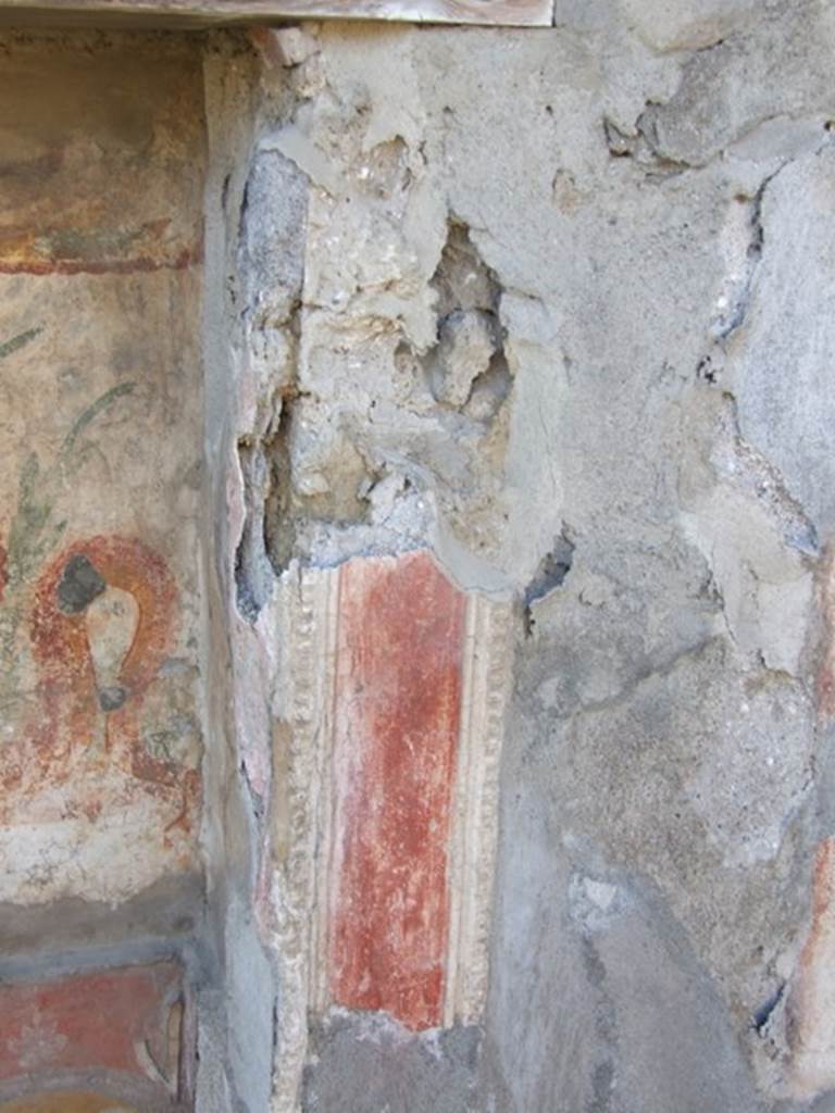 V.3.7 Pompeii. March 2009. West wall of garden area. North side of lararium with decorative stucco
