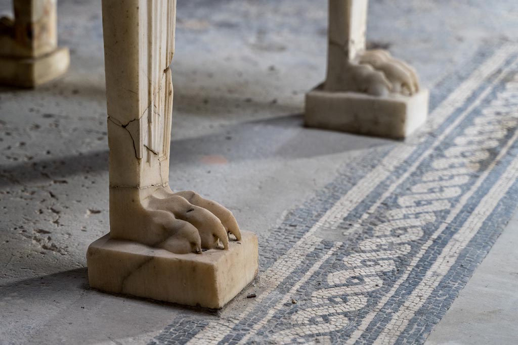 V.4.a Pompeii. January 2023. Detail of table feet on east side of impluvium. Photo courtesy of Johannes Eber.