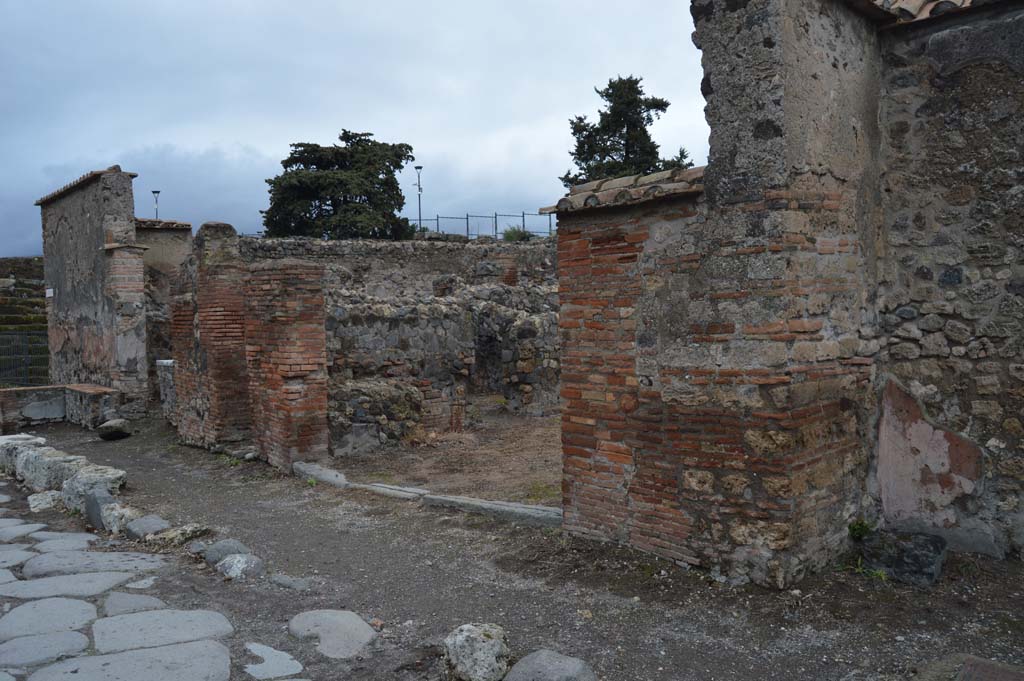 VI.1.4 Pompeii. March 2019. Looking north-east on Via Consolare to entrance doorway, in centre and towards VI.1.2, on left. 
Foto Taylor Lauritsen, ERC Grant 681269 DCOR.
