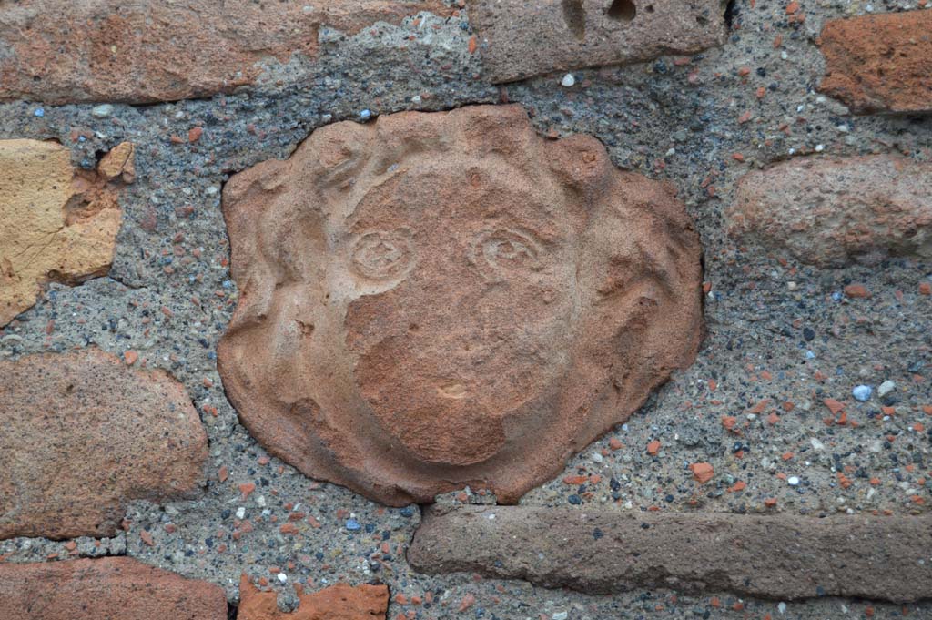 VI.1.4 Pompeii. March 2018.Terracotta mask of head embedded in masonry on south side of entrance doorway.
Foto Taylor Lauritsen, ERC Grant 681269 DCOR.
