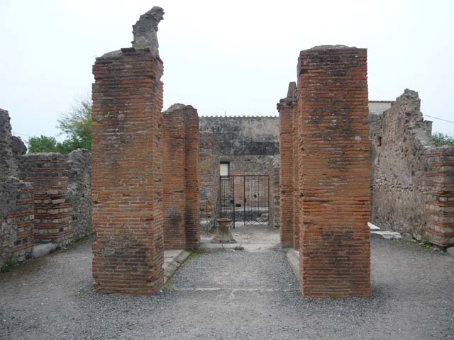 VI.3.3 Pompeii. March 2009. Room 5, Looking south along east wall, with small hatch from oven.