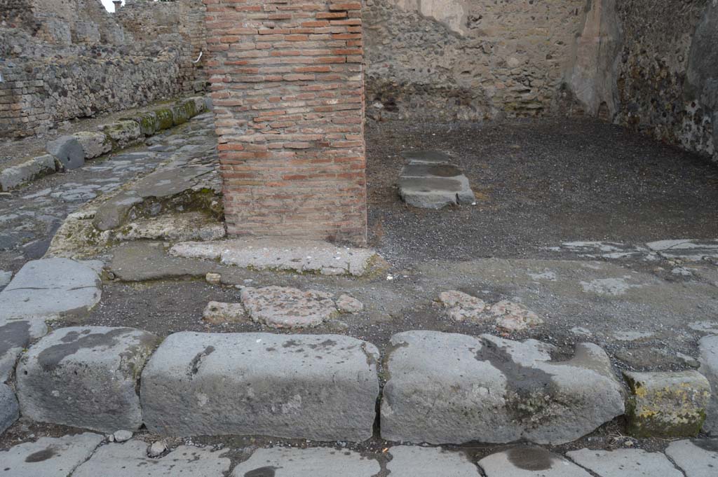 VI.8.4 Pompeii. March 2018. Looking north to pavement at junction of Via delle Terme and Vicolo della Fullonica, on west side of doorway.  
Foto Taylor Lauritsen, ERC Grant 681269 DCOR.

