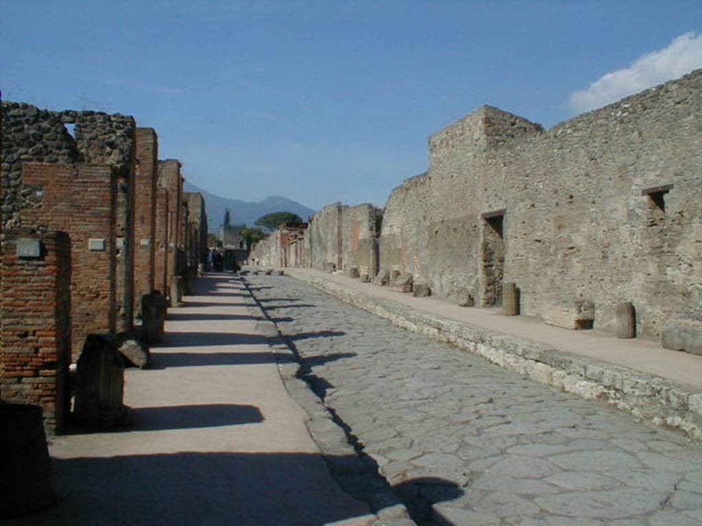 VI.8.12 Pompeii. September 2005. Looking north along Via di Mercurio from near VI.8.12. According to Garcia y Garcia, a bomb fell here in the first bombing raid at about 5 oclock on 13th September 1943. It fell in the road facing the entrances at VI.8.12 and 13, disrupting the road and pavement for about 3metres. See Garcia y Garcia, L., 2006. Danni di guerra a Pompei. Rome: LErma di Bretschneider. (p.76)

         
