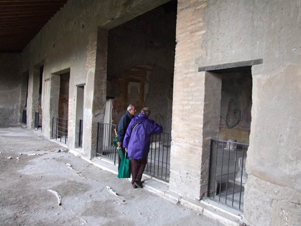 VI.11.10 Pompeii. December 2006. Rooms on north side of the peristyle 36, with three doorways of room 43, on right.