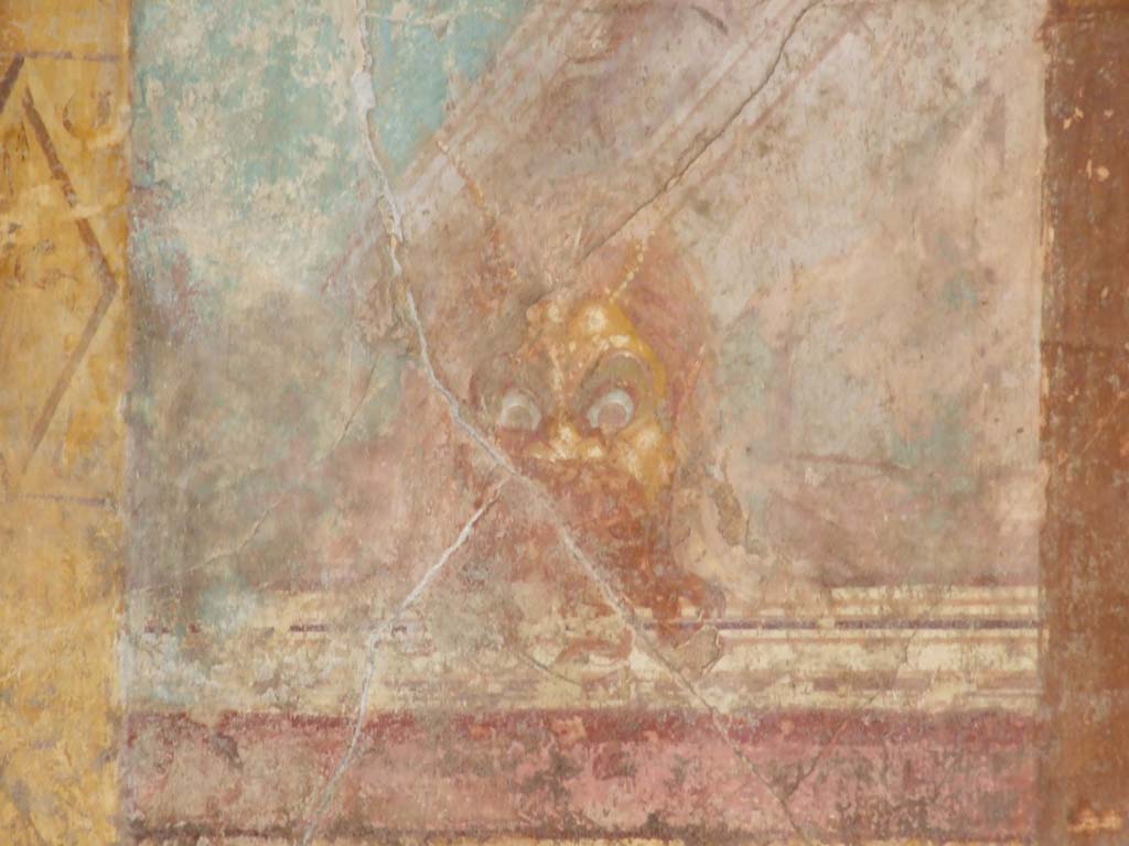 VI.11.10 Pompeii. December 2007. Room 43, painted mask from east wall at south end.