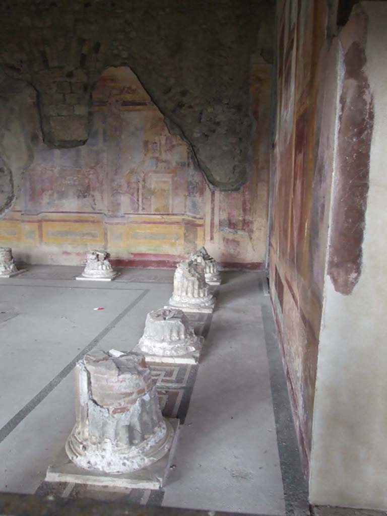 VI.11.10 Pompeii. December 2006. 
Room 43, looking north along “corridor” behind remains of columns, on east side.  
