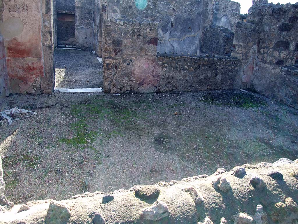 VI.11.10 Pompeii. December 2007. Room 35, looking south through window from south portico, towards doorway to atrium 27.