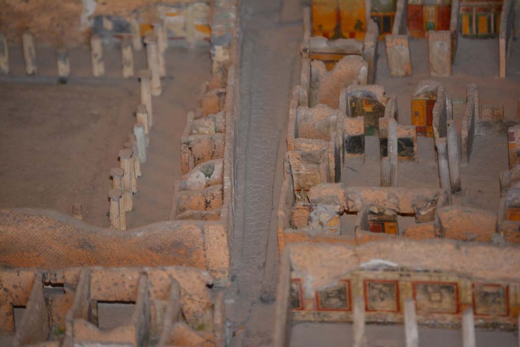 VI.11.9/10 Pompeii. July 2017. 
On the right, across the centre, rooms on the west side of atrium 27 features the black painted room 28, the yellow/red painted room 29, undecorated corridor 48, and room 31, west ala.
From cork model in Naples Archaeological Museum.
Foto Annette Haug, ERC Grant 681269 DCOR.
