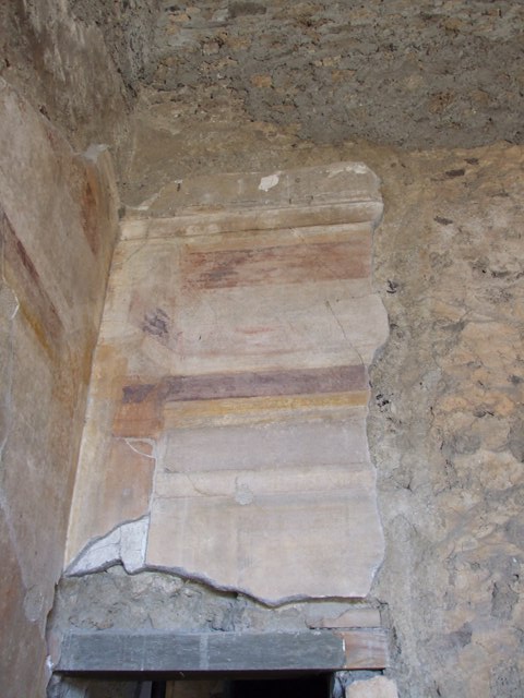 VI.11.10 Pompeii. May 2006. Vicolo del Labirinto looking north along east wall of house, on left.