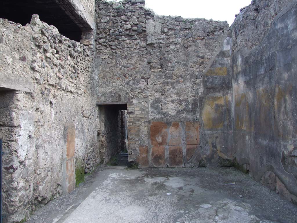 VI.12.2 Pompeii. March 2009. South wall with doorway to another corridor leading to rooms on east side of house.