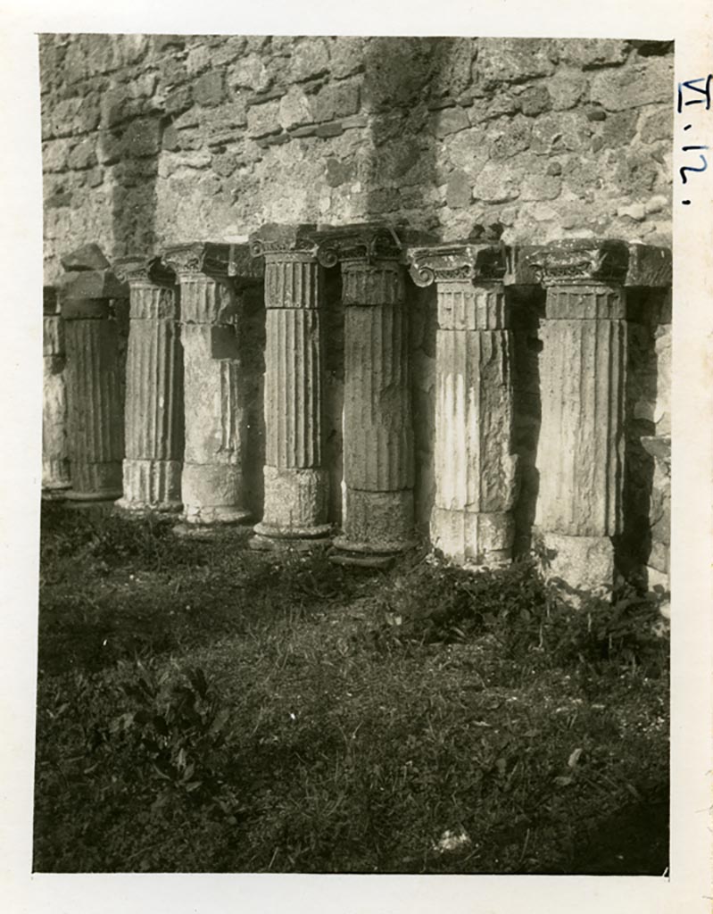 VI.12.2 Pompeii. pre-1937-39. Remains of columns and capitals against east wall of rear peristyle.
Photo courtesy of American Academy in Rome, Photographic Archive.  Warsher collection no. 1422.

