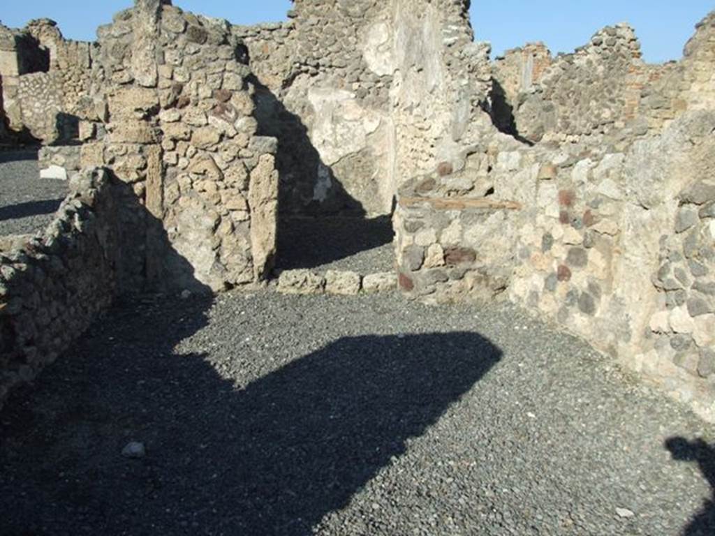 VI.14.3 Pompeii. December 2007. North wall with hearth in north-east corner and doorway to rear room.