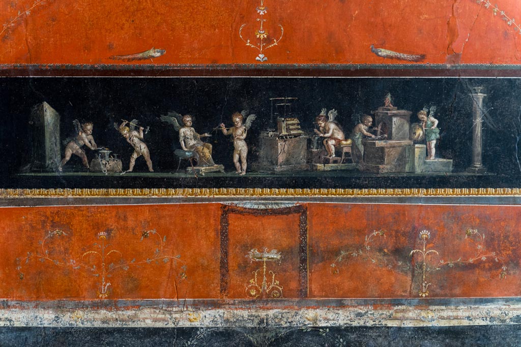 VI.15.1 Pompeii. March 2023. Painted panel showing cupid goldsmiths. Photo courtesy of Johannes Eber.