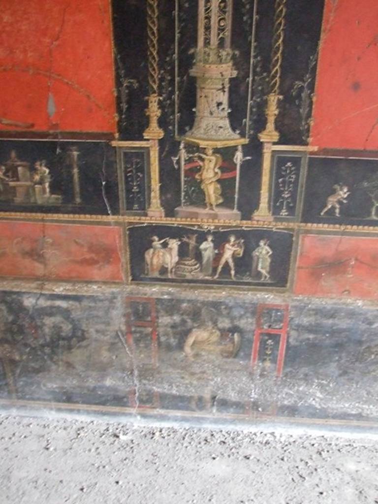 VI.15.1 Pompeii.  December 2006. Room of the Cupids or Cherubs. East wall  with painting of Apollo and Diana after the killing of the python. Underneath is a standing figure of an Amazon armed with shield.

