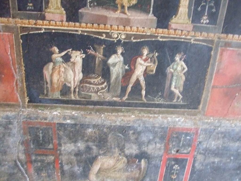 VI.15.1 Pompeii.  December 2006. Room of the Cupids or Cherubs. East wall. Detail of painting of Apollo and Diana after the killing of the python. Underneath is a standing figure of an Amazon armed with a shield.
