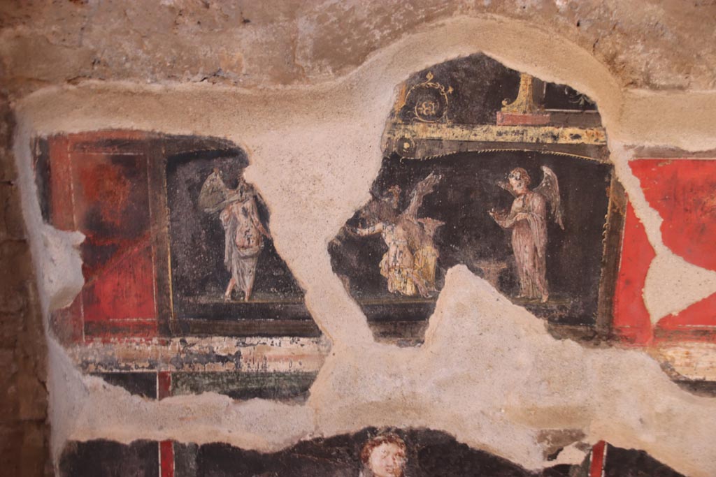 VI.15.1 Pompeii.  December 2006. Room of the Cupids or Cherubs.  
Wall painting showing Orestes and Pylades at Tauris in the presence of King Thoas and of Iphigenia who is now a priestess of Artemis. Underneath is a standing figure of an Amazon armed with a shield.
