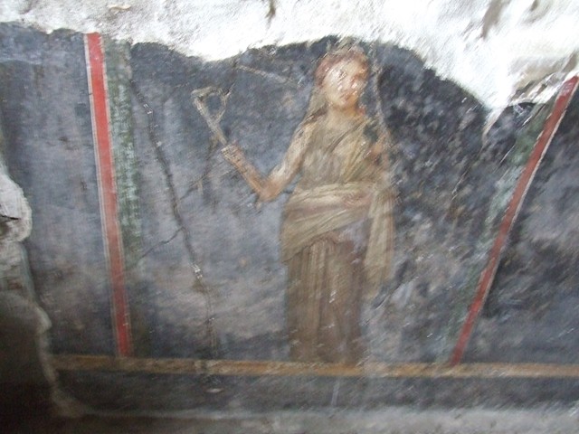 VI.15.1 Pompeii. October 1992. West wall with painting of cupids buying and selling wine.
Photo by Louis Méric courtesy of Jean-Jacques Méric.
