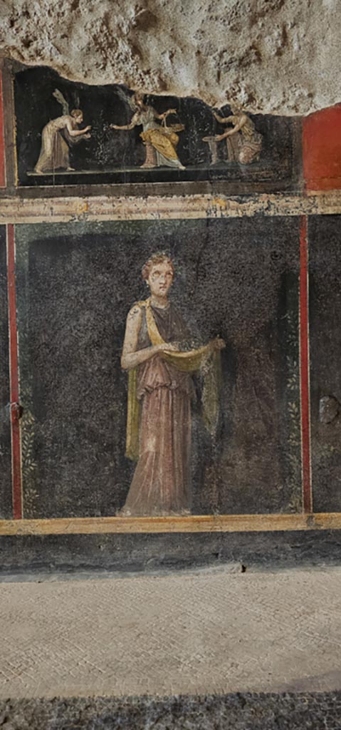 VI.15.1 Pompeii. December 2023. 
Predella and zoccolo at north end of west wall. Photo courtesy of Miriam Colomer.
