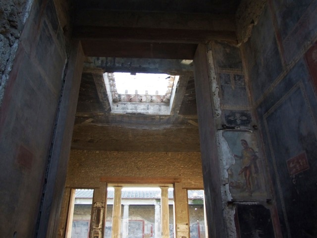 VI.15.1 Pompeii. December 2007. Looking west from entrance, looking up to compluvium above atrium.